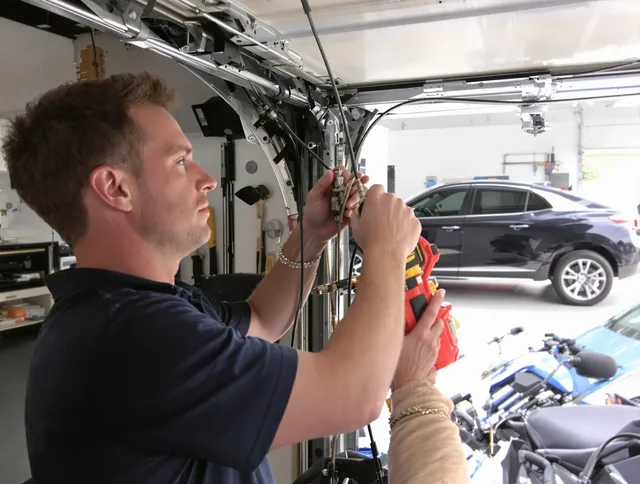 Tega Cay Garage Door Repair safety certified technician performing cable replacement in Tega Cay