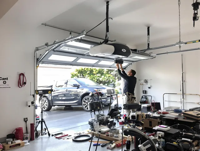 Tega Cay Garage Door Repair specialist installing smart garage door opener system in Tega Cay home