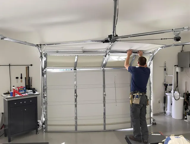 Tega Cay Garage Door Repair specialist performing precise section replacement on Tega Cay garage door